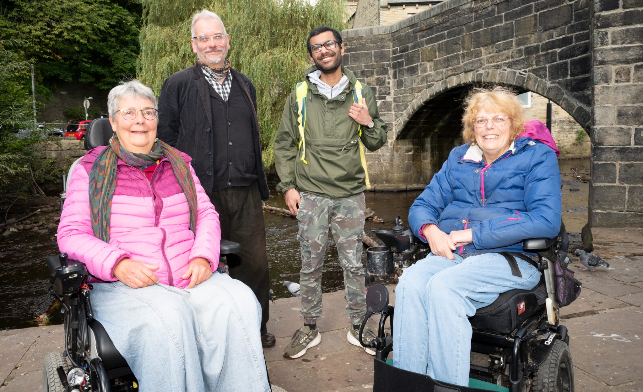 A photograph of HBDAF members Judy and Helen by the Wavy Steps in Hebden Bridge, with the river Calder in the background.